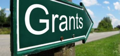 signpost with the word grants on it